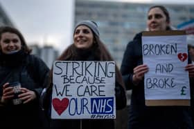 NHS physiotherapists take part in a strike outside of St Thomas’ Hospital on January. (Photo by Carl Court/Getty Images)