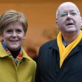 Former First Minister for Scotland and former leader of the Scottish National Party (SNP), Nicola Sturgeon, stands with her husband husband Peter Murrell.   (Photo by ANDY BUCHANAN / AFP) (Photo by ANDY BUCHANAN/AFP via Getty Images)