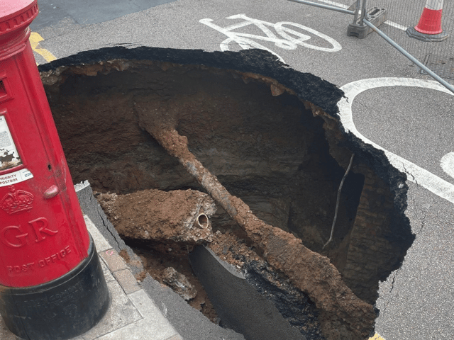 Mysterious sinkhole appears in UK and almost gobbles post box - motorists beware 