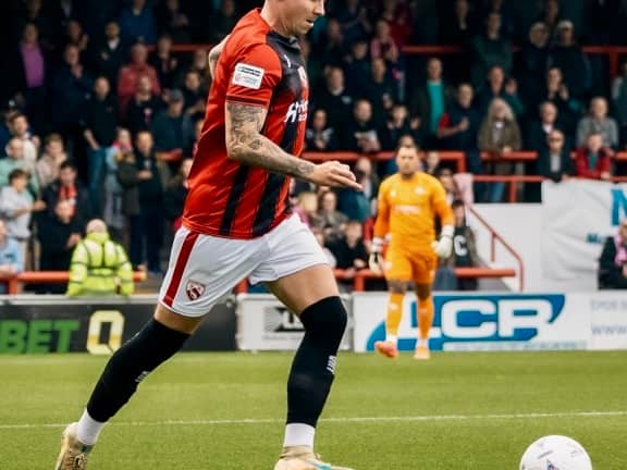 Morecambe's Cameron Coxe came close to a second-half equaliser in their FA Cup defeat
