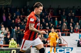 Morecambe's Cameron Coxe came close to a second-half equaliser in their FA Cup defeat