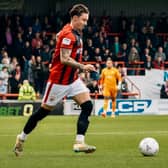 Morecambe's Cameron Coxe came close to a second-half equaliser in their FA Cup defeat