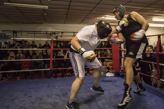 Andy Ellis (right of pic), Emma's husband, fighting Joe Greenwood at the boxing fundraiser at Red Rose Community Centre on Saturday night. Photo credit: Rachel Landsborough.