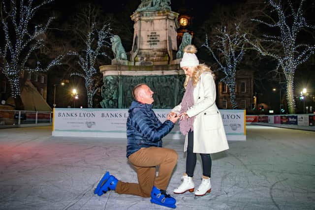 Stephen Gott proposes to Leah Palmer. Photo: Darren Robinson Photography.