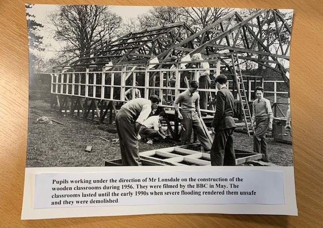 Bentham Grammar School feature. Pupils working under the directioon of Mr Lonsdale on the construction of the wooden classrooms during 1956. They were filmed by the BBC in May. The classrooms lasted until the early 1990s when severe flooding rendered them unsafe and they were demolished. Picture courtesy of Bentham Grammar School.
