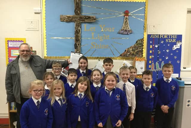 Thurnham Glasson Primary School pupils with poet Bryan Griffin.