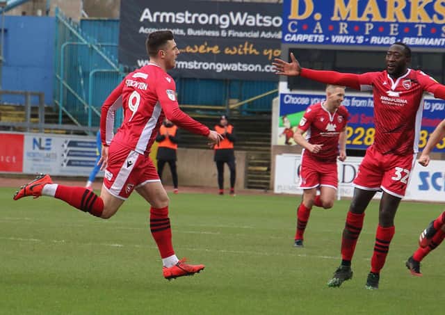 Cole Stockton celebrates his goal at Carlisle United