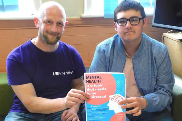 Chris Smith and Simon Crabtree with the mental health poster designed by young people in Wyre (pictured in 2018)