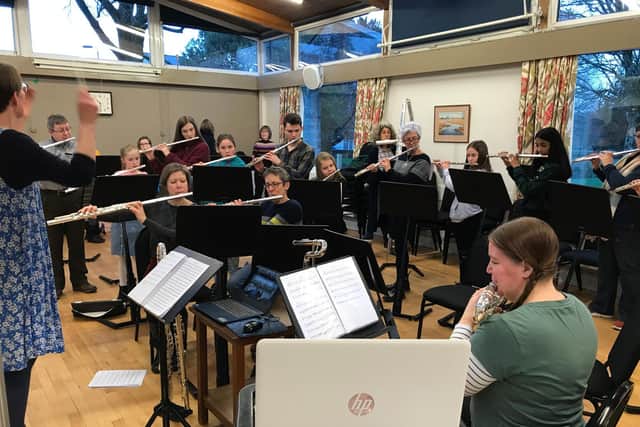 Flutes and Co rehearsing with Zoom on the computer so other members can join remotely.