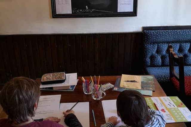 The pub's dining room has become a temporary classroom