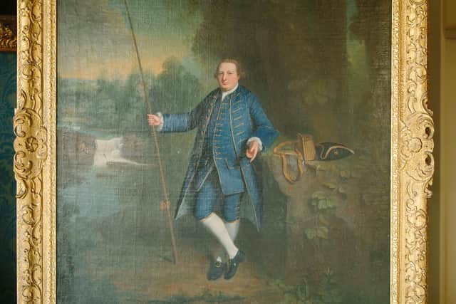 Steven Barber. Portrait of Charles Strickland with Fishing Rod in situ in the Drawing Room at Sizergh. The painting is by Dalton born artist George Romney. Picture credit: National Trust/Steve Barber.