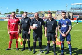 Chris and Dave Holt with the match officials before the Reece Holt Memorial Cup match. Photo by Chris Brown Photography.