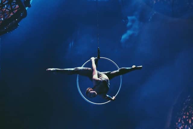 Holly Johnstone performing acrobatics on stage. Photo: Bastien Colliard.