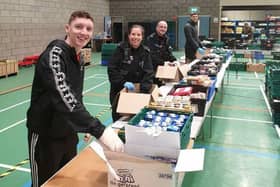 Police staff help out at the emergency hub at Salt Ayre