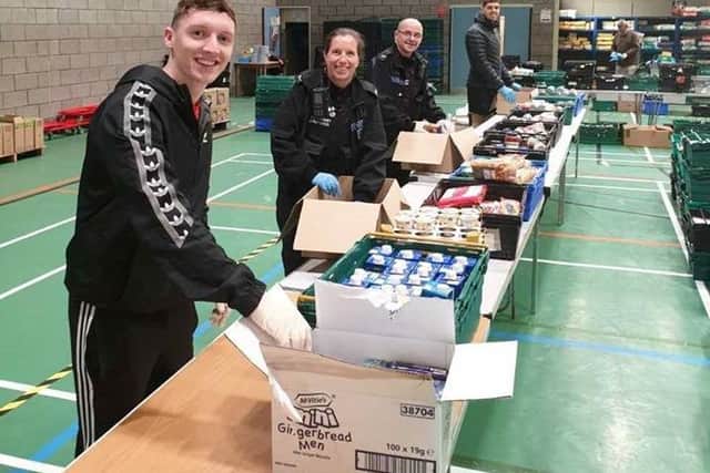 Police staff helping out at Salt Ayre Leisure Centre.