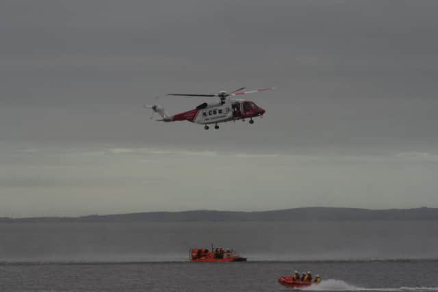 Morecambe Coastguard helicopter on an exercise with the RNLI lifeboat and hovercraft.