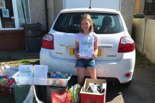 Karen Watson's daughter Molly helping out with the collection.