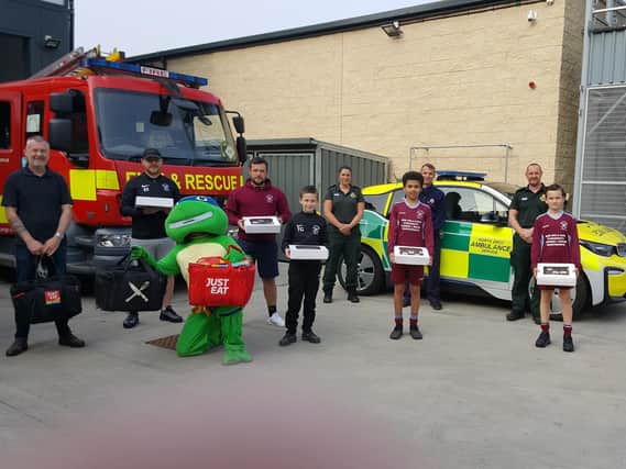 Players from Westgate Wanderer's under 12's team donated cakes and pizzas to key workers at the fire and ambulance station in Lancaster to say thank you for all their hard work during the coronavirus pandemic.