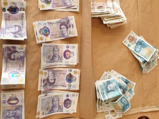 A large amount of crack cocaine and heroin, several thousands of pounds in cash and numerous mobile phones has been recovered