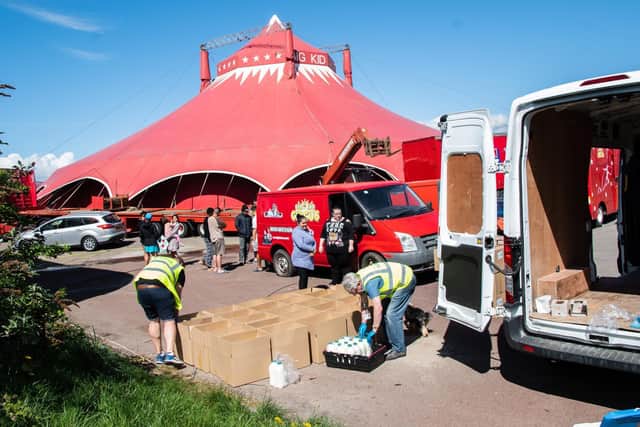 Morecambe Bay Foodbank delivers supplies to the Big Kid Circus community, while the artists queue to collect their share.