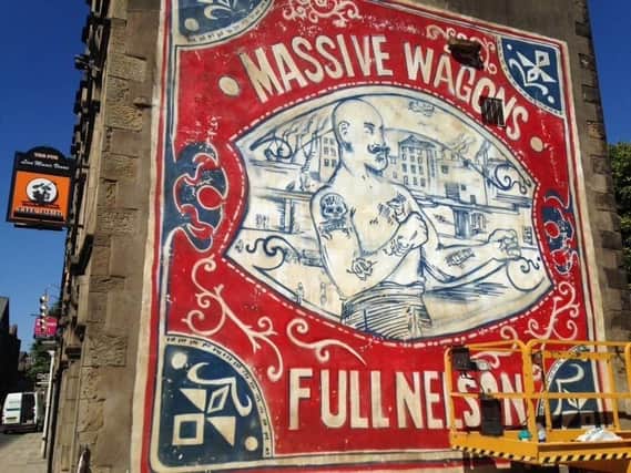 The Massive Wagons mural on the side of The Pub.