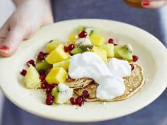 Coconut pancakes with tropical fruit