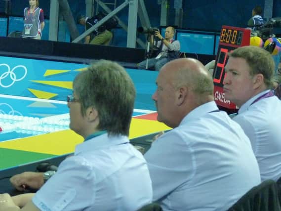 Duncan Holme, middle, officiates at the London Olympic Games in 2012