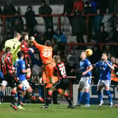 Barry Roche heads home Morecambe's equaliser against Portsmouth