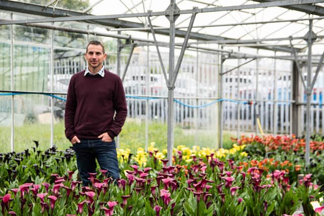 Matthew pictured in one of the glasshouses at Brighter Blooms