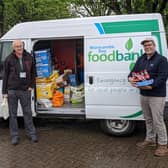 Foodbank trustee John Entwistle (left) with James Ventham from Windermere Lake Cruises.
