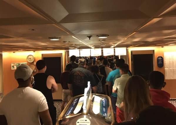 Staff queue on board the ship.