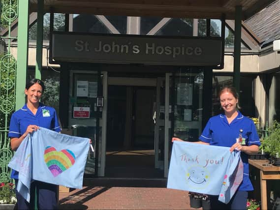 Hospice at Home nurses Natalie Duncan and Ceri Owen-Wilding with some uniform bags.