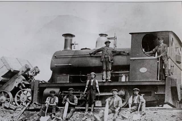 The locomotive 'Queen Victoria' built in 1901, took away the spoil from the coal mine and made some considerable changes to the Ingleton landscape. From left: John Thomas Bradley (tip end man), Joe Walker (greaser), Billum Wilcock (labourer), Thomas Whitham (labourer(), Anthony Noble (killed April 1915), Joack Gott (ganger) and W.L.Routledge (loco driver). Photography by W.L.Routledge.