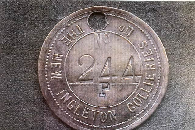 Miners tag circa 1919, found in the land clearance of the New Ingleton Colliery site.