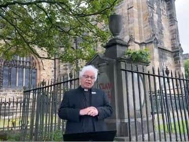 The Rev Chris Newlands making a statement in front of the Rawlinson memorial.