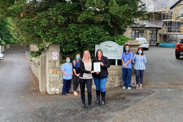 Laura Prince and Kirsty Mills present an iPad to the Hillcroft Nursing Home, Caton.