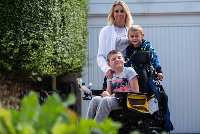 Jack Sowden (13) with his mum Samantha Leyshon and brother Daniel has launched a petition for better disabled access in Morecambe. Photo: Kelvin Stuttard.