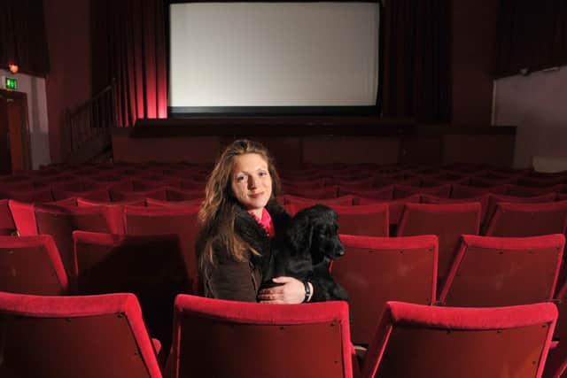 Lara and cinema dog Bruce, pictured in January 2018, preparing for the cinema's reopening