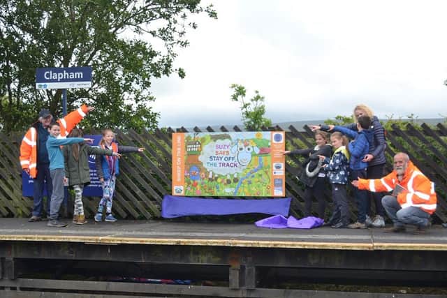 Some of the children at Clapham School with their rail safety panels at Clapham railway station.
