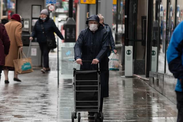 Shoppers in Lancaster get used to the new face coverings rule. Photo: Kelvin Stuttard