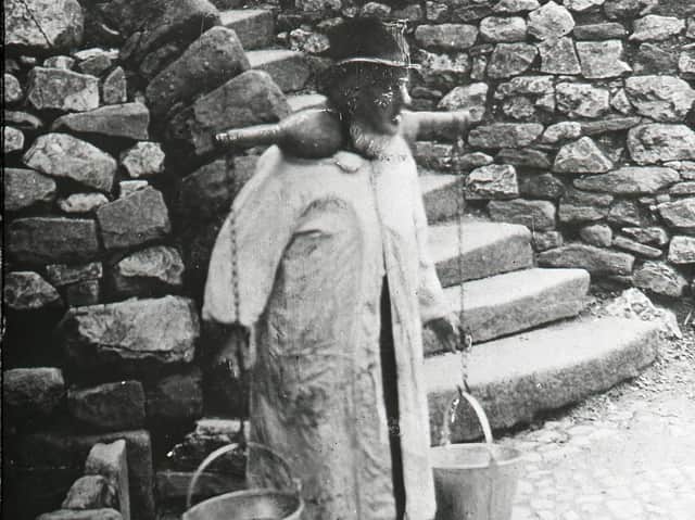 Collecting water at 'Slippy Slops'. (Riley Collection).