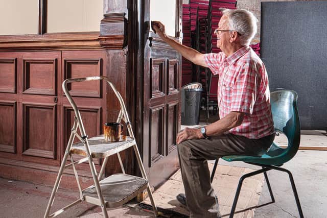 Restoration and maintenance volunteer Bernie, a retired French Polisher from Waring and Gillow. Photo: Alun Bull, Historic England