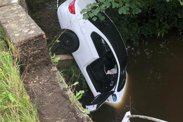 A white BMW plummeted into a canalin Forton. (Credit: Lancashire Police)