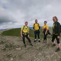 Hikers Katie McTernan, James March, Charlotte March and Louise Quinn at the summit of Helvellyn, one of four peaks they were able to complete during a five hour hike for Defying Dementia.
