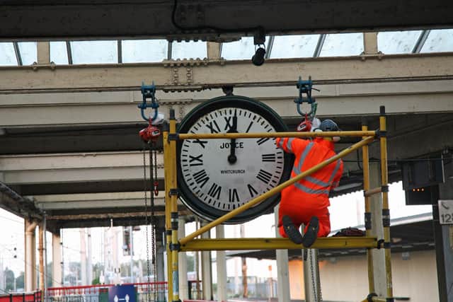 Preparing the clock for removal. Photo: Robert Swain
