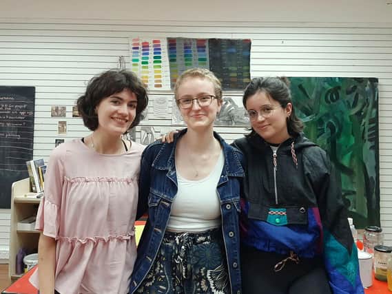 Housemates and Lancaster University graduate artists Georgina Harris, Kasia Tatys and Nria Rovira prepare for their community project.
