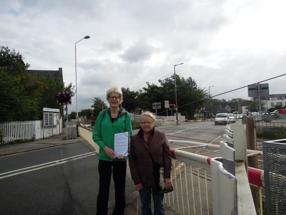 Pictured are Susan Potts from the Bare Community Association and Coun Stephie Barber with queuing traffic on Bare Lane.