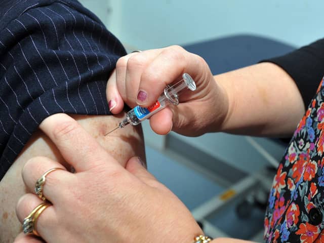 Nurse practitioner Julie Balmer, right, injects Doctor Kate Ardern, as she gets a flu jab to promote campaign to get members of the public vaccinated against the flu virus.