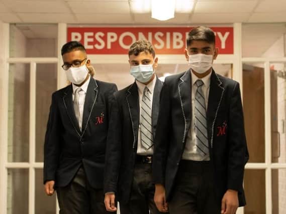 Some schools have asked students to wear only plain blue or black face masks. Photo: Stock image by Getty Images