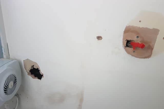 The bathroom ceiling in the council flat which the tenant had to try and repair herself after it was left in this condition following the third leak in three years.